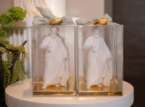 Saint Peter bonbonniere statues displayed in clear gift boxes with gold bases and ribbon, ideal for baptisms and religious events