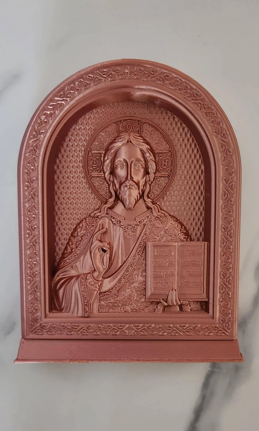 Arched icon of Jesus Christ holding a book