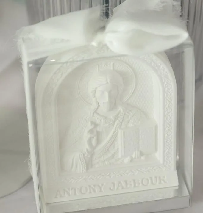 A boxed Christ Pantocrator icon favour with a personalised name on the base and a white ribbon