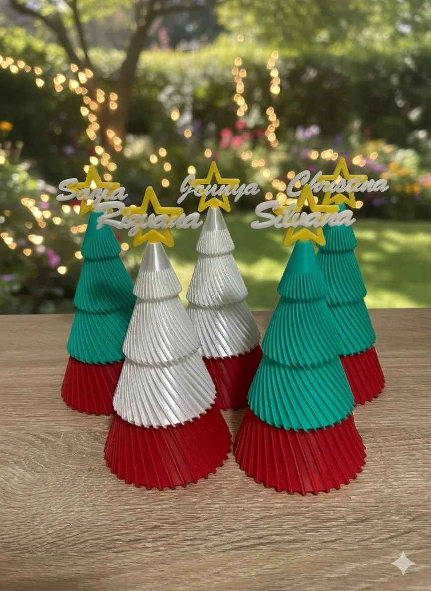 Personalised tiered Christmas trees in green and white with red bases and name stars