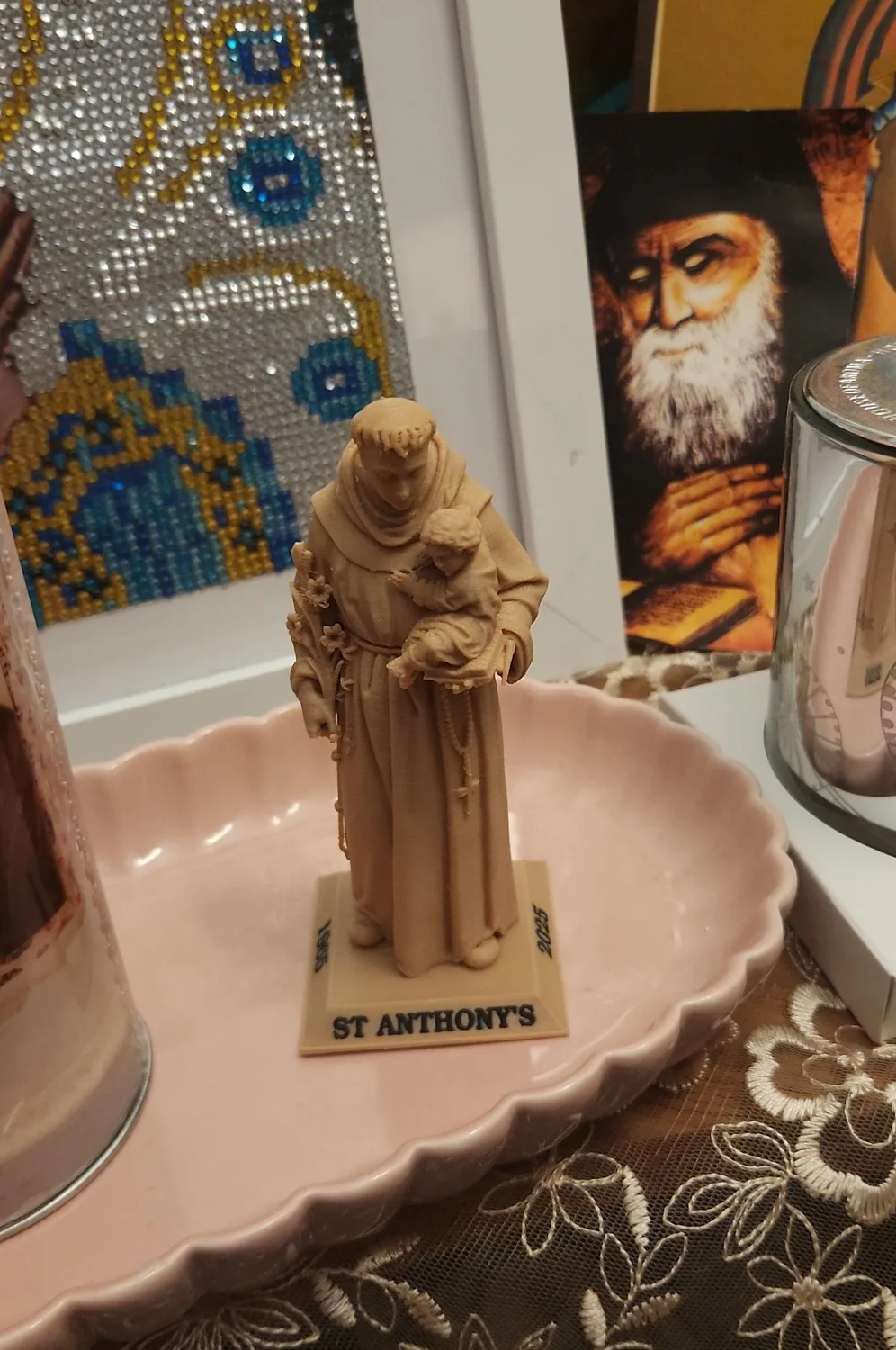 Saint Anthony of Padua statues in four finishes, each on an inscribed base