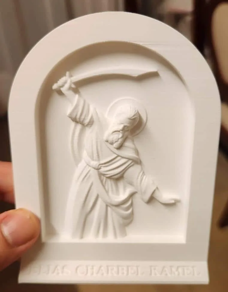 White arched Saint Elias icon favour with an inscription on the base