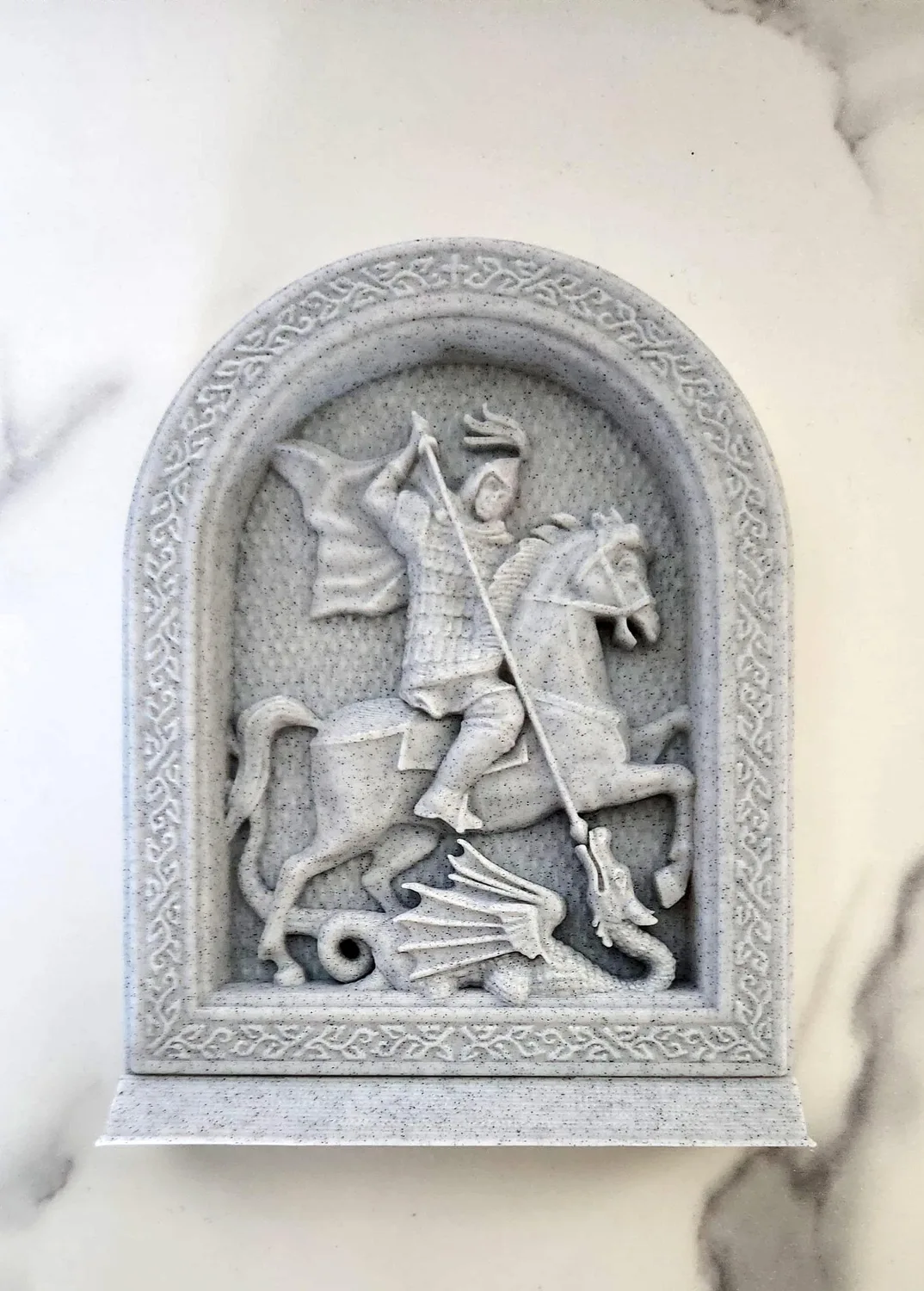 Arched icon of Saint George on horseback defeating the dragon