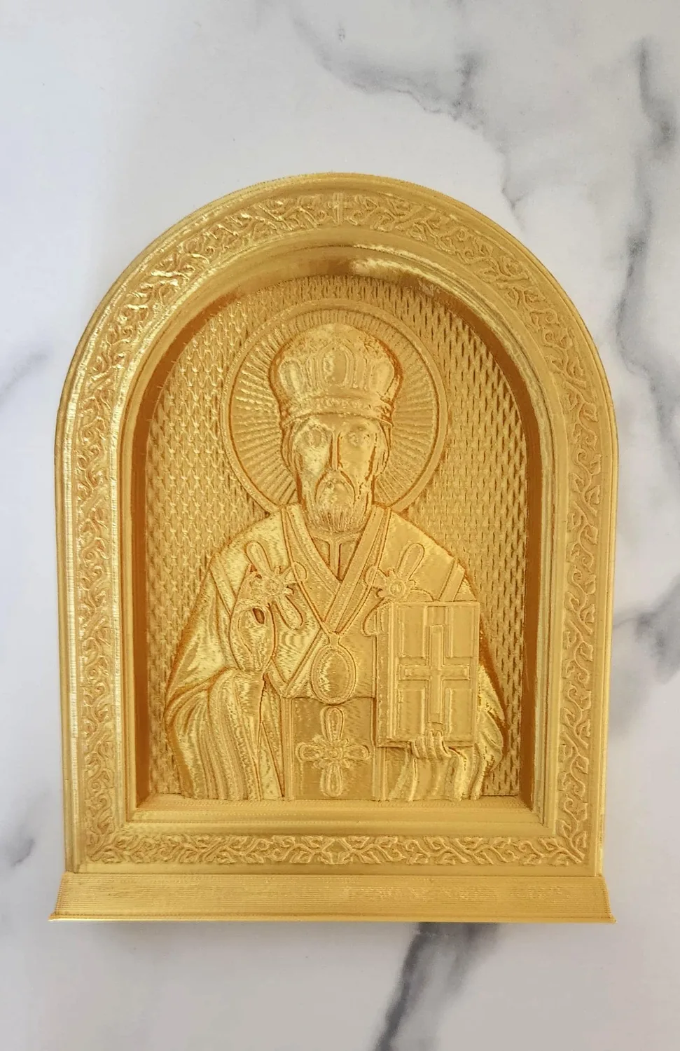 Arched icon of Saint Nicholas the Wonderworker in gold