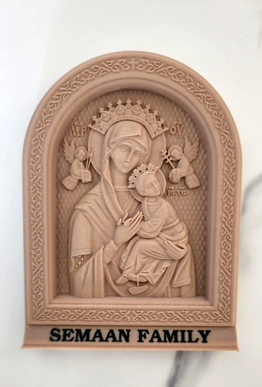 Arched icon of the Virgin Mary holding the infant Jesus