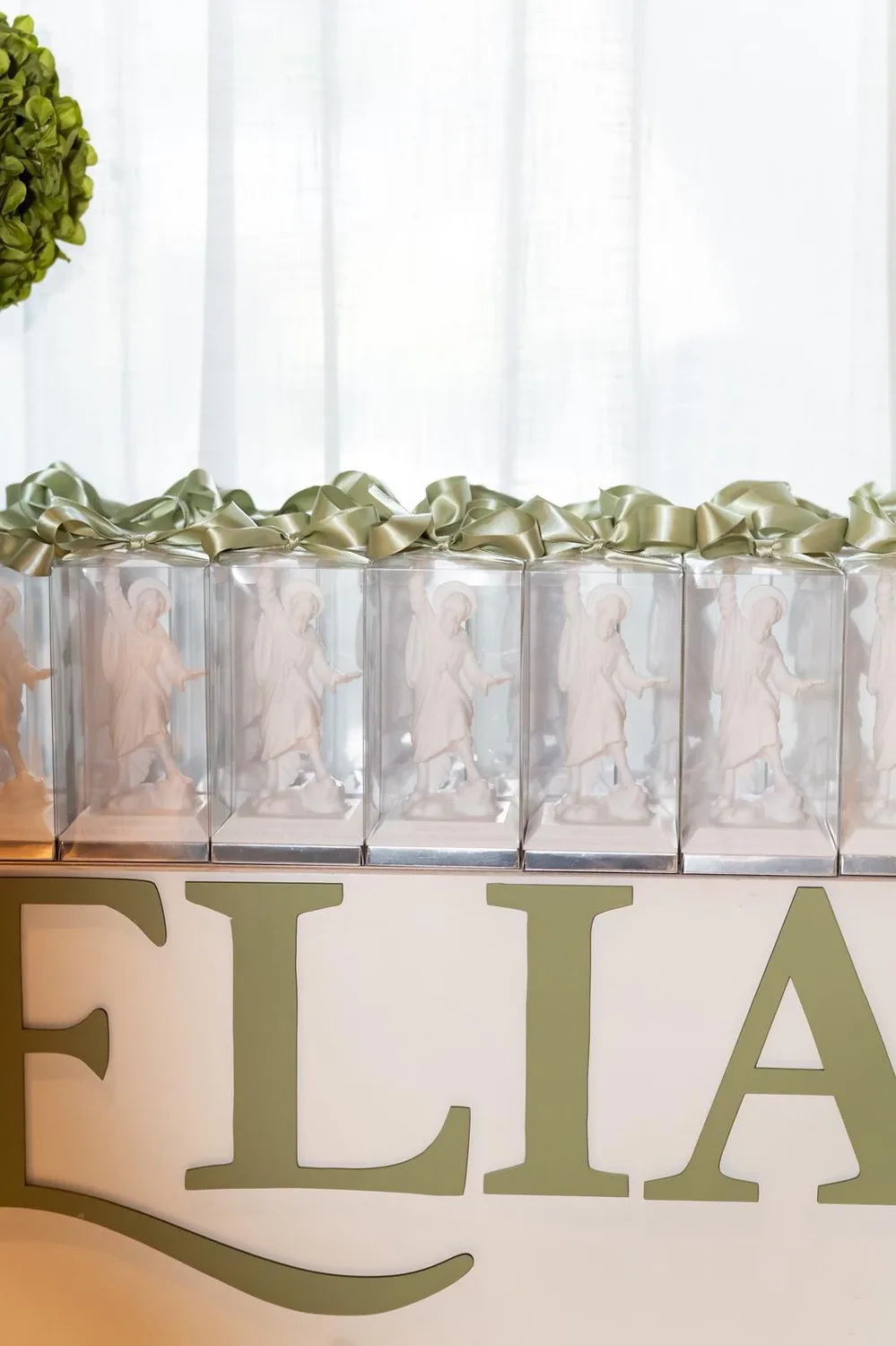 Boxed sculptural favours arranged together on an event table
